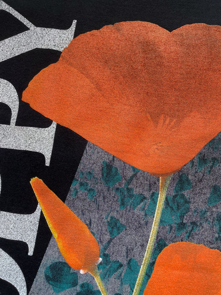 Close-up of an orange flower with a black and white patterned background